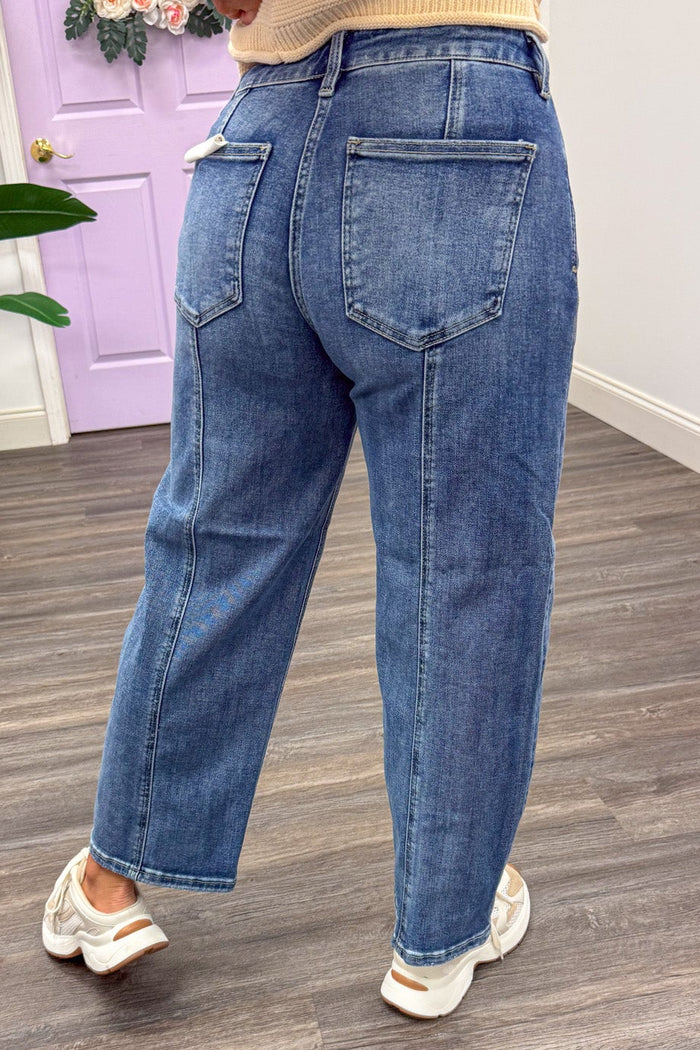 medium washed slouchy cropped length barrel leg high rise jeans with five pocket design