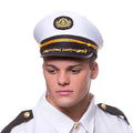 Man wearing a classic ship's captain hat in white and black woth gold braid detailing for fancy dress uniforms parties