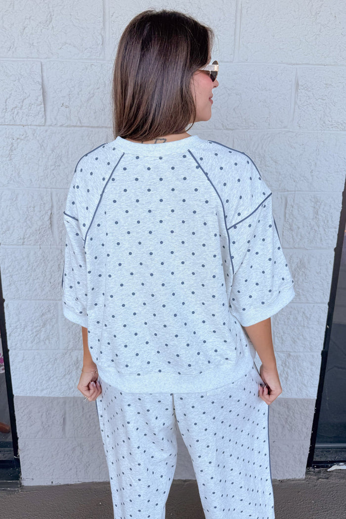 washed heather grey with navy polka dot print short sleeve terry knit top with navy piping details