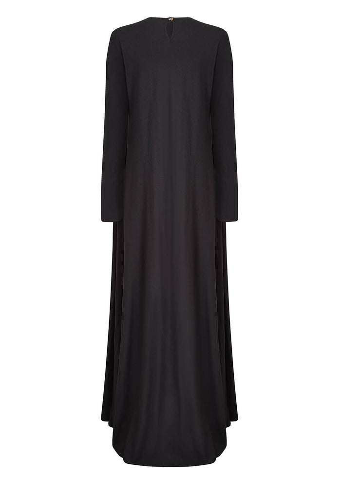Black colour. Cut in 100% cotton jersey with a fitted bodice &amp; voluminous drop. Styling details include a round neckline with subtle pleats. Features button fastenings on the back &amp; sleeve cuffs.&nbsp;