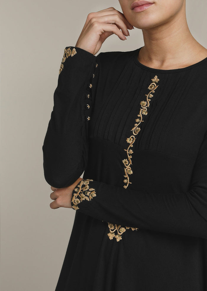 Beautiful embroidery on the front bodice, sleeves &amp; back. Cut in a fluid a line silhouette providing you with lots of movement whilst you walk. Black