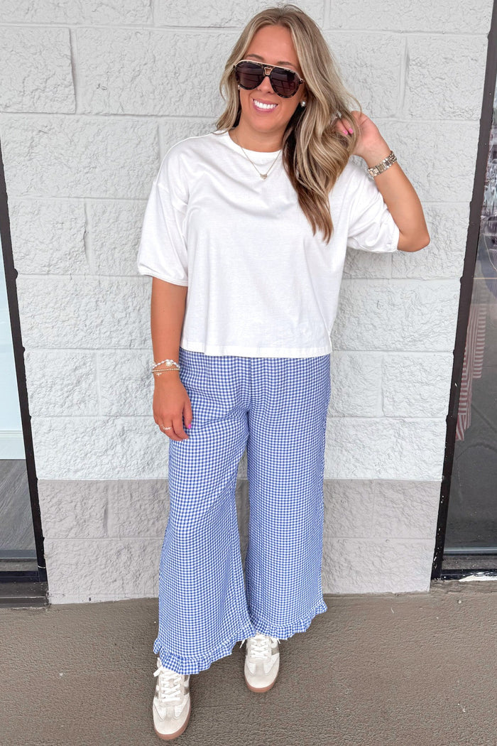 dark blue and ivory gingham checkered print ruffle hem wide leg pants