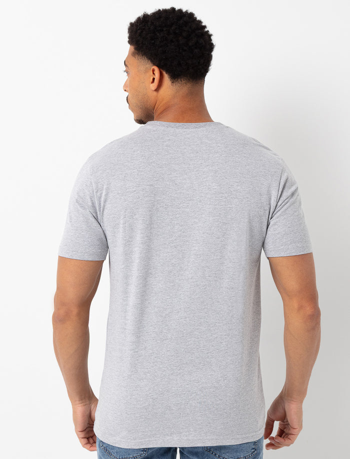 T-shirt uni à poche imprimée